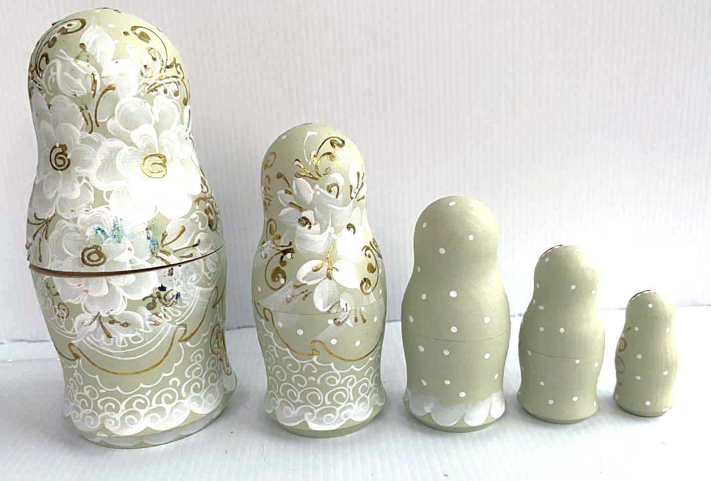 Artists Matryoshka Green Woman clasping hands