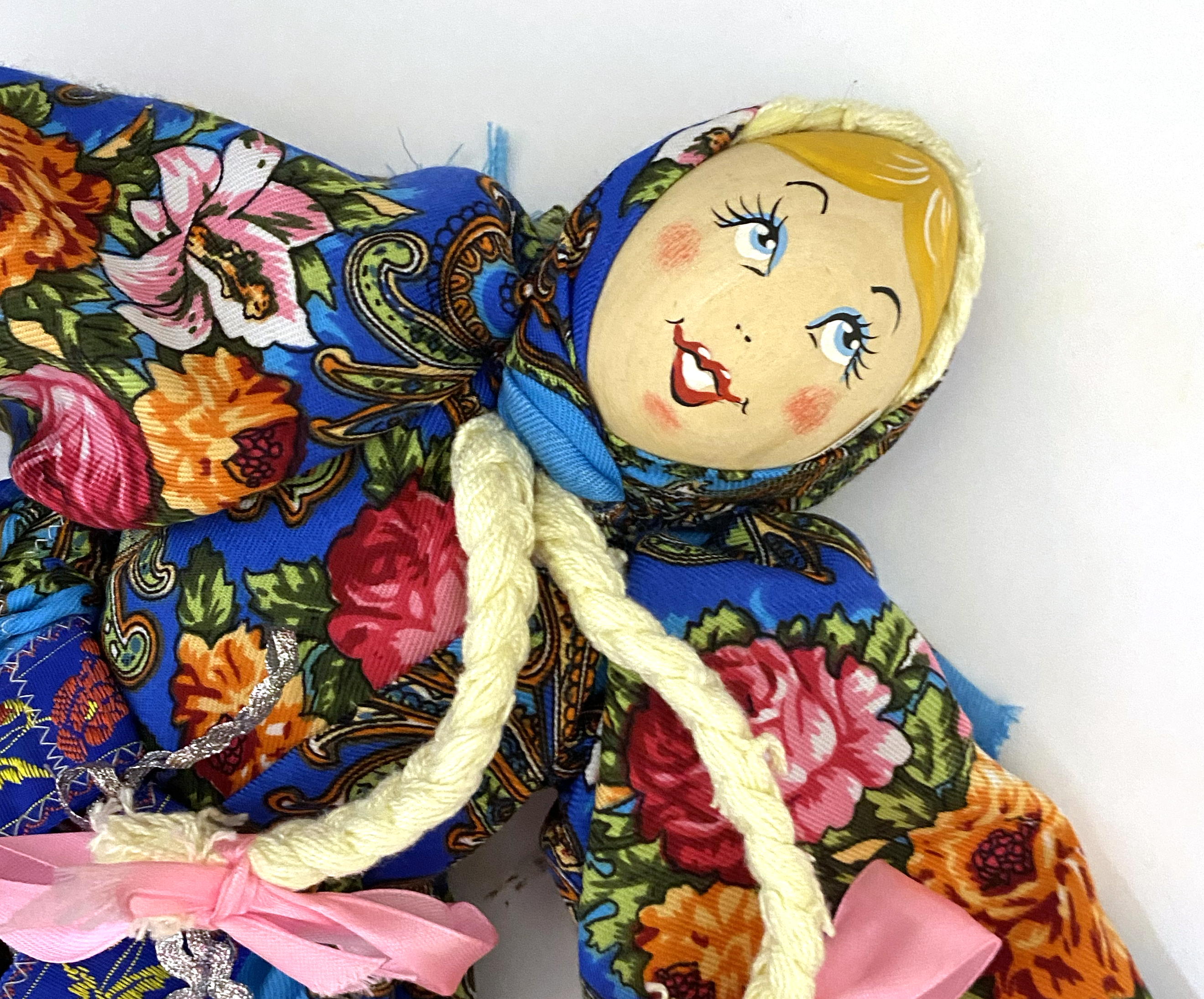Cloth doll with wooden face, girl in blue sarafan