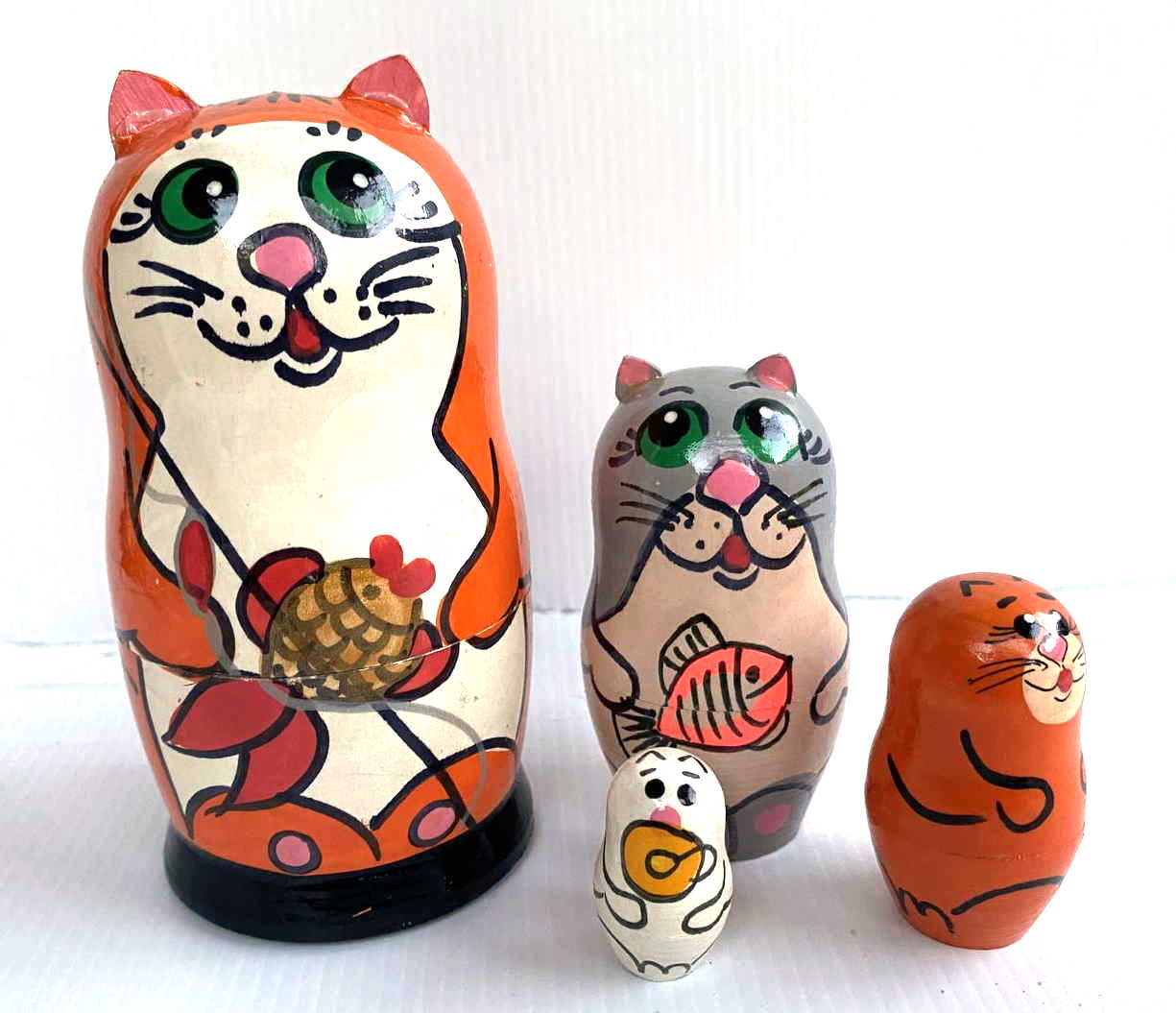 Matryoshka small orange cat with fish