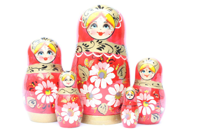 A 5 Nested set of Artists Matryoshka, Red Girl with 3 white/pink flowers