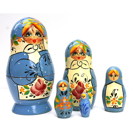 A 5 Nested set of Artists Matryoshka, Blue pink flower on white apron and white dots