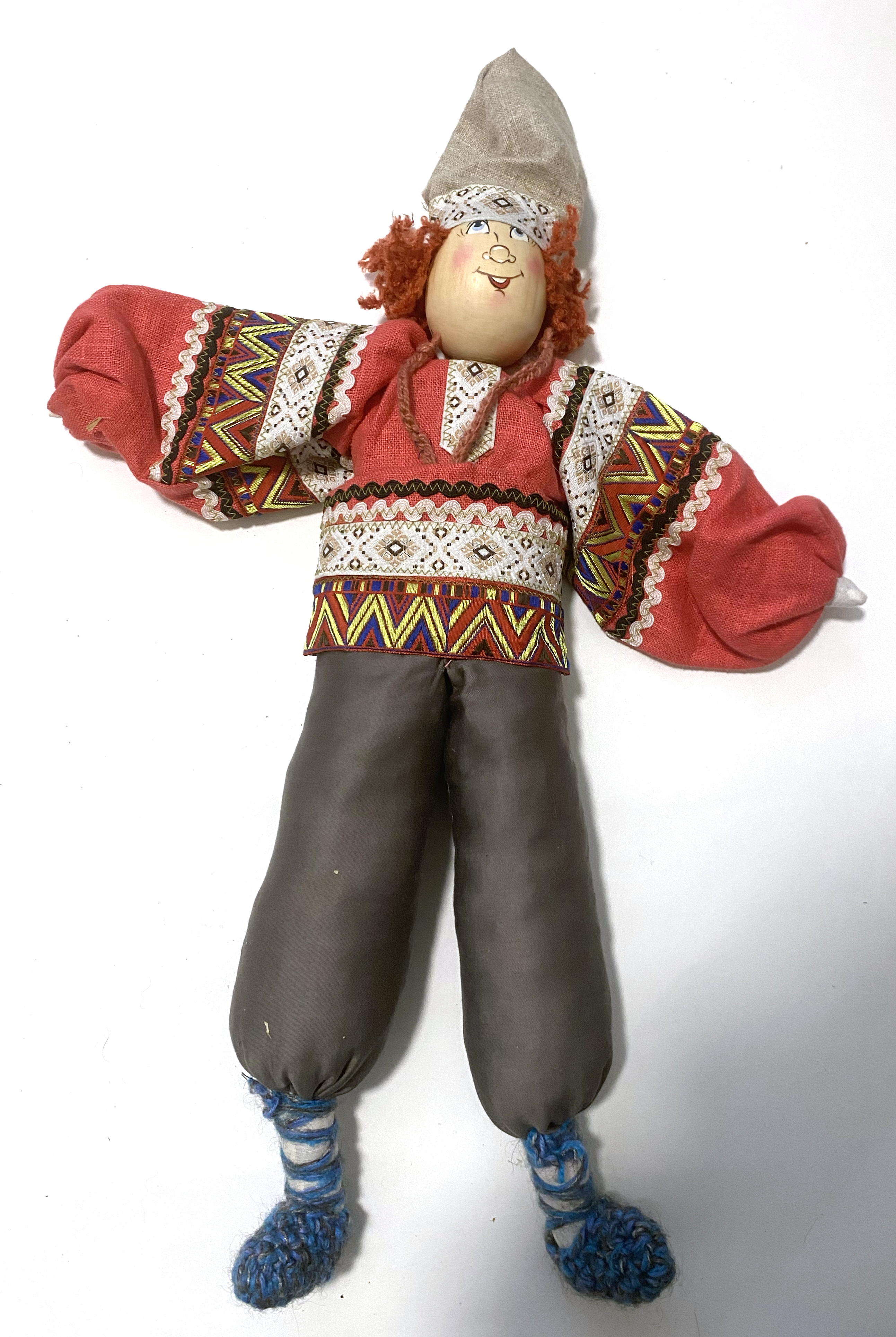Cloth doll with wooden face, red headed boy