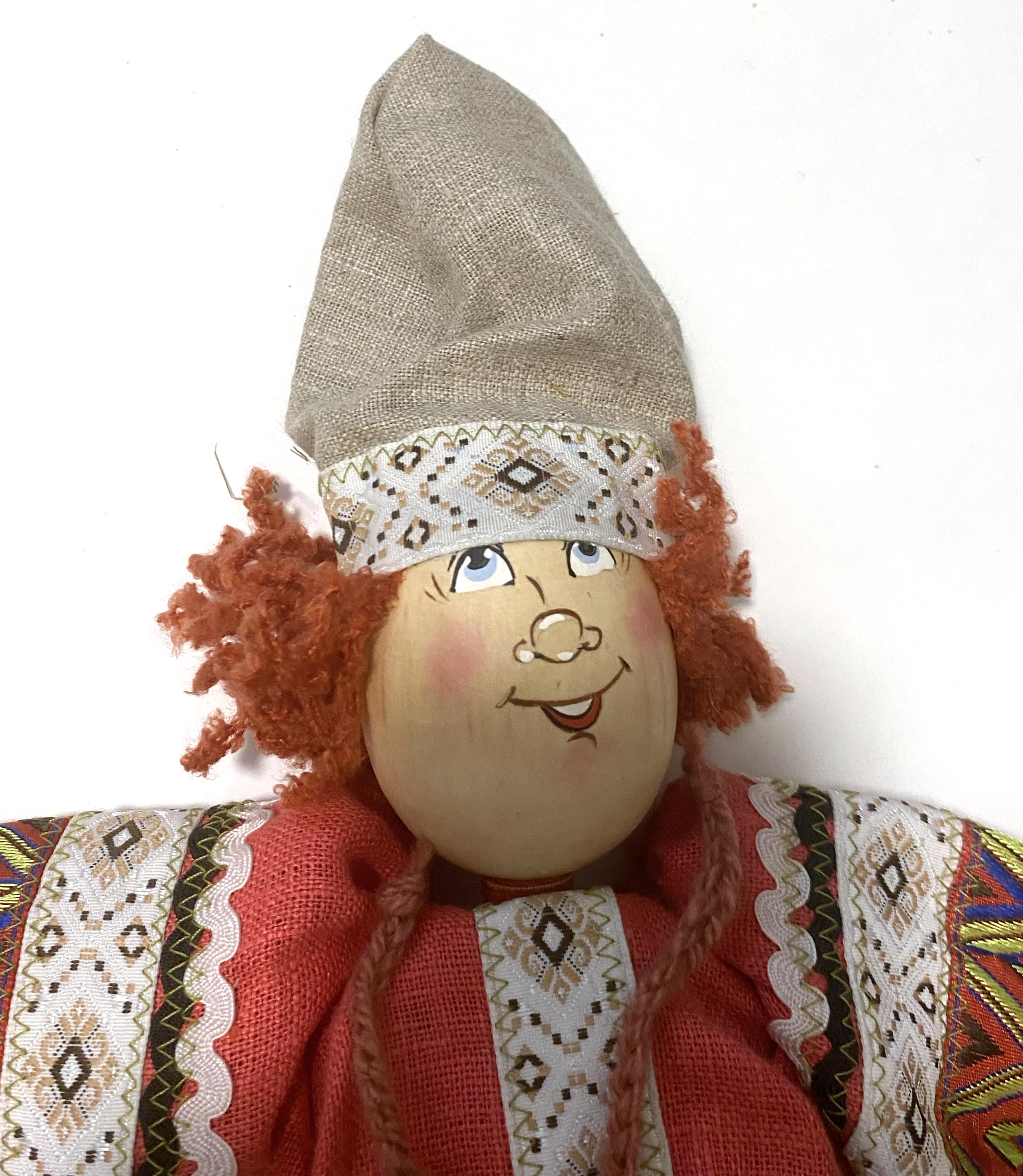 Cloth doll with wooden face, red headed boy