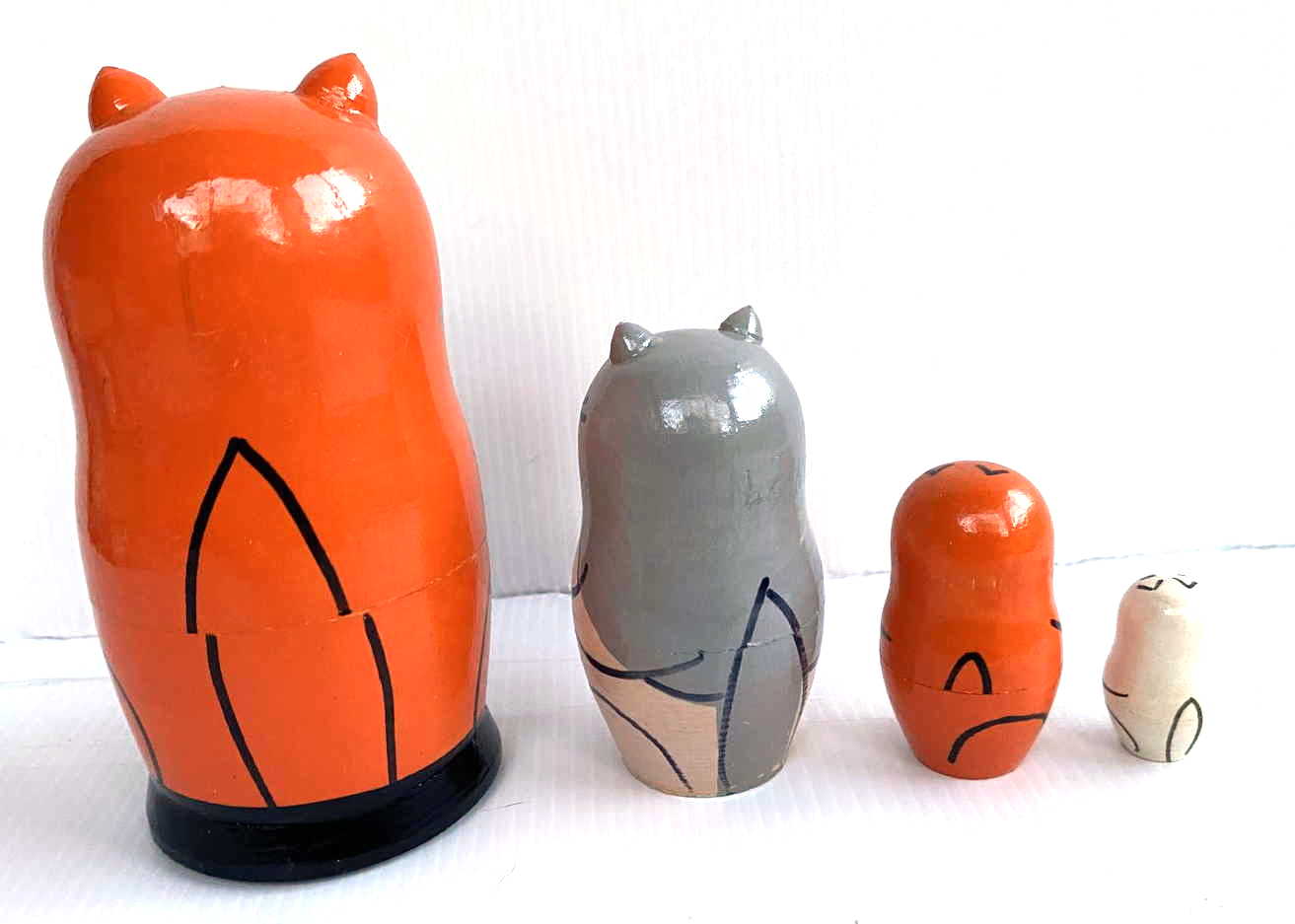 Matryoshka small orange cat with fish