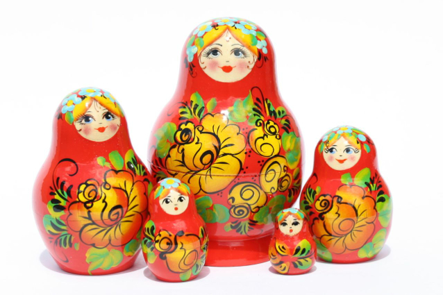 A 5 Nested set of Artists Matryoshka, Red girl/flowers