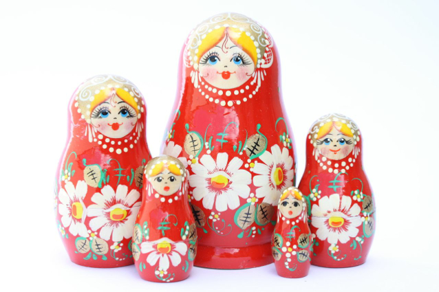 A 5 Nested set of Artists Matryoshka, Red girl with white flowers
