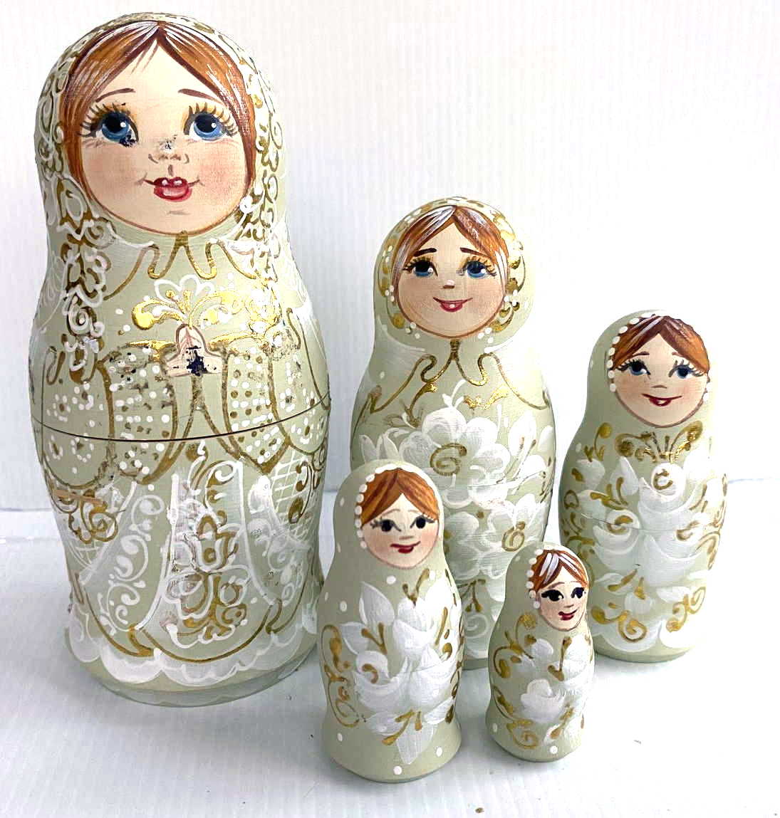 Artists Matryoshka Green Woman clasping hands