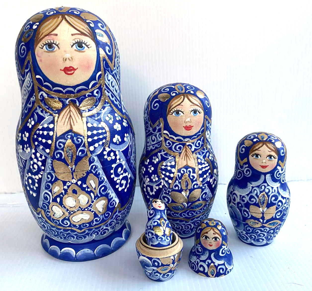 Artists Matryoshka Woman clasping hands