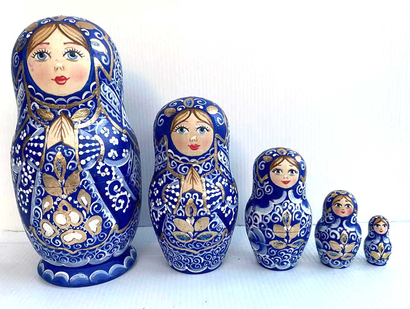Artists Matryoshka Woman clasping hands