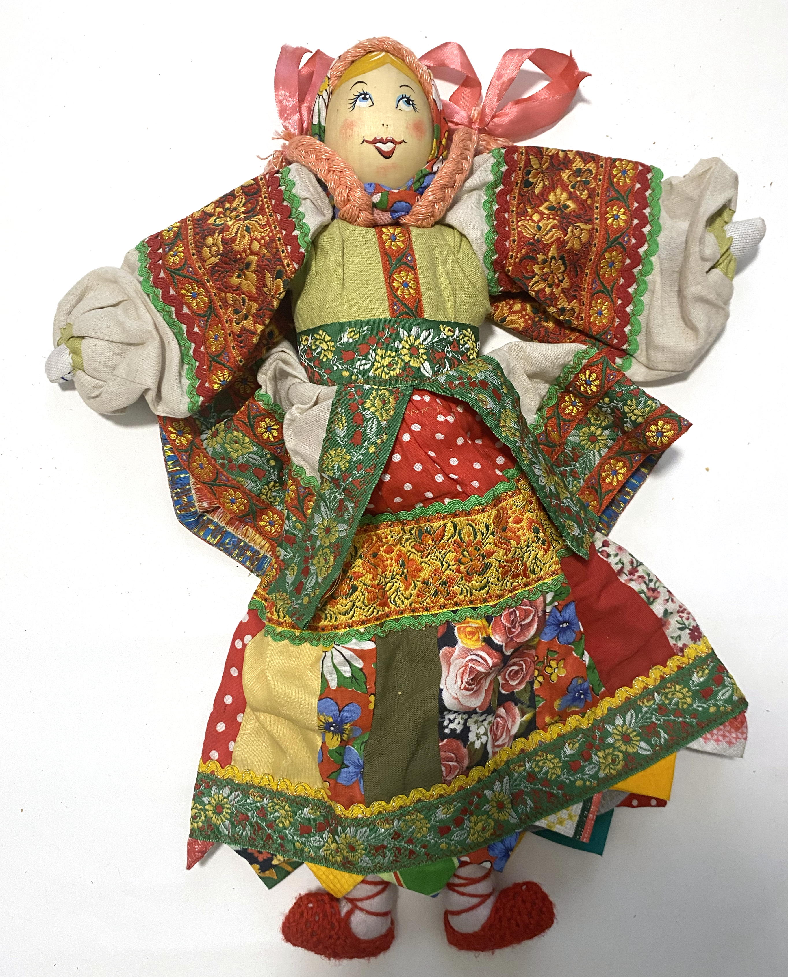 Cloth doll with wooden face, pink braided girl